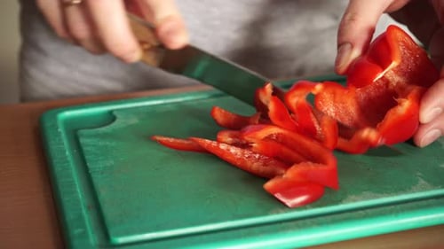 Slicing Red Pepper on a Cutting Board