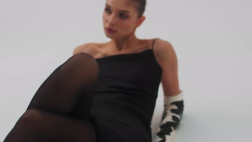 Sexy Fashion Model Woman Laying at Studio Beauty Strong Face Elegant Makeup