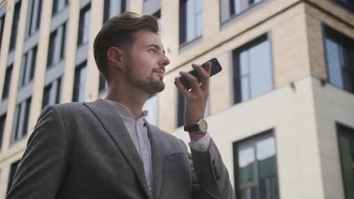 Young Adult Man Talking on Phone Outdoors