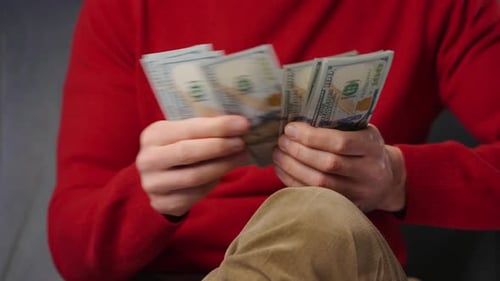 Counting One Hundred Dollar Bills Close Up