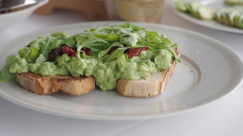 Avocado Toast with Greens and Dried Tomatoes