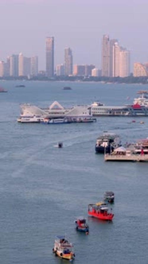 Pattaya cityscape vertical time lapse video from a viewpoint on a hill. Pattaya city, Thailand.