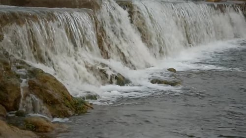 Catching a waterfall in a small freshwater channel.