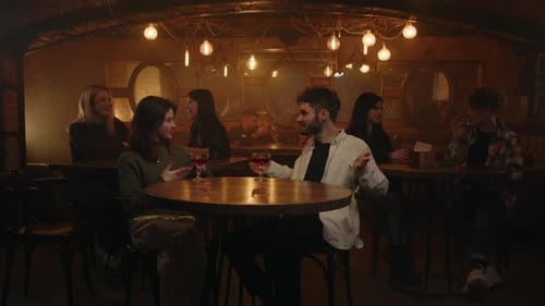 Men Gesturing When Talking with Girlfriend He Mets in Bar Young Woman and Man Having a Date on