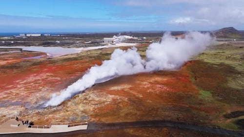 Aerial view of geothermal hot springs with steam, Iceland.