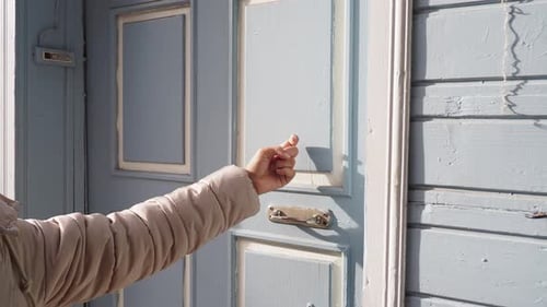 Young Women Hand Knocking Door