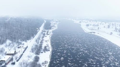 Aerial View of Snowy River Landscape in Winter