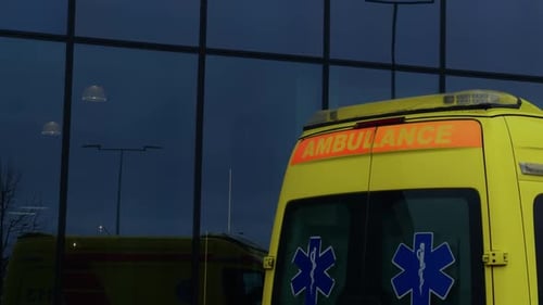 An Electric Blue Ambulance Vehicle Parked Outside a Building