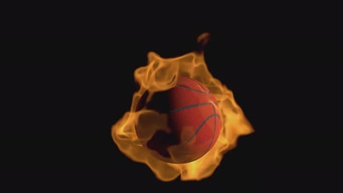 A basketball ball flies and burns while spinning