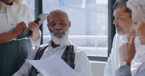 Paperwork, meeting and business people in discussion in the office conference room planning