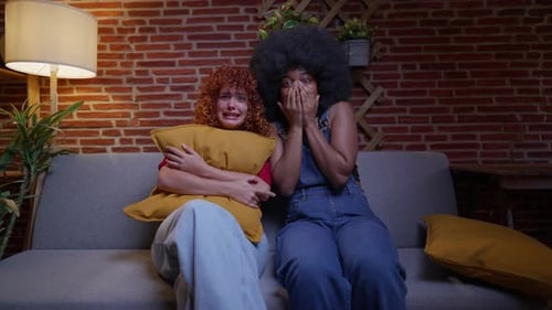 Friends Watching a Scary Movie at Home