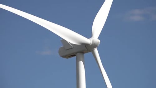 Wind turbines turning in strong winds.