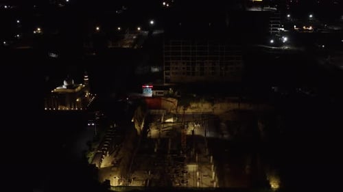 Aerial Drone Shot Of Construction Building At Night