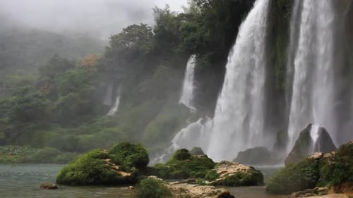 Strong waterfalls in Ban Gioc, Vietnam, water flowing on a big rock.