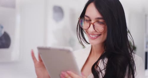 Woman Using Tablet Indoors