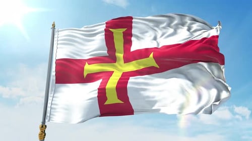 Guernsey Flag Waving Against a Clear Blue Sky
