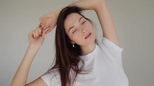 Portrait of Beautiful Young Woman Young Woman with White Tshirt at Studio