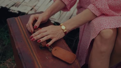 Woman With Leather Suitcase in Rural Setting