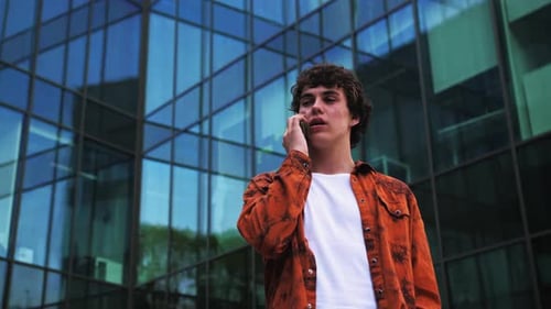 Asian Young Smart Businessman Talking in Telephone in City The Man Outdoor to Working Office with