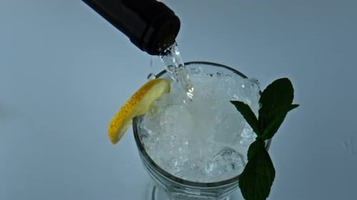 Refreshing Cocktail Pouring in Slow Motion