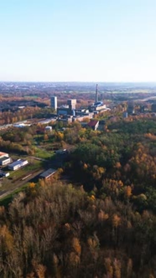 Drone reveals Karvina Armada redundant coal mine amid autumn woodland