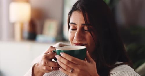 Young Woman Enjoying Coffee Moment at Home