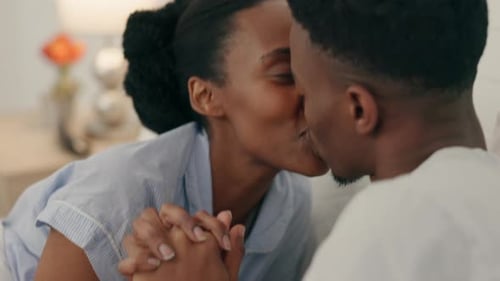 Loving Couple Holding Hands and Kissing Indoors