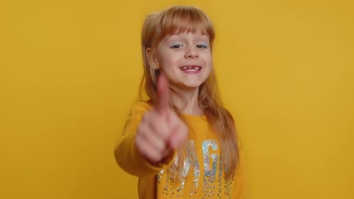 Child Girl Kid Smiling Excitedly and Pointing Finger to Camera Choosing Lucky Winner Indicating