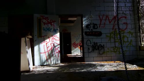 Interior Creepy Hospital Asylum Doorway with Urban Decay and Graffiti