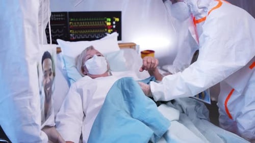 Unrecognizable Doctors and Covid-19 Infected Patient in Bed in Hospital, Coronavirus Concept