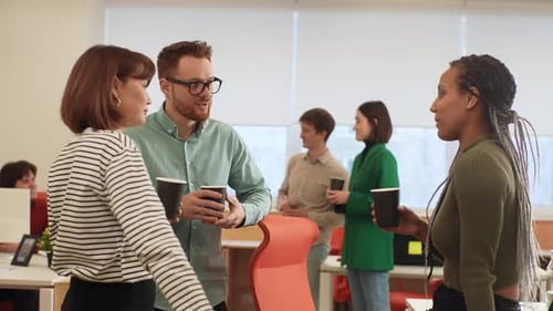 Office Employees Talking Holding Cups