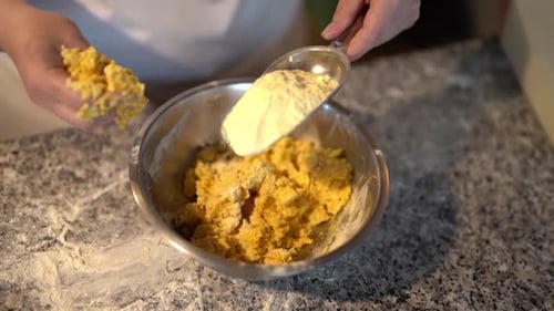 Adding Flour to Dough in Bowl for Baking