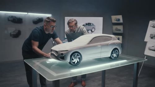 Experienced Automotive Designers Discuss the Design in a High Tech Room with LED