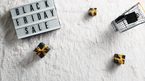 Black Friday Message with Gifts and Shopping Cart