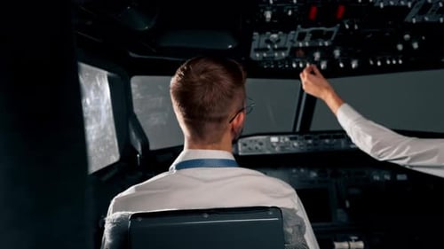 Airplane cabin Pilots check airplane electronics by pressing buttons Passenger airliner preparation