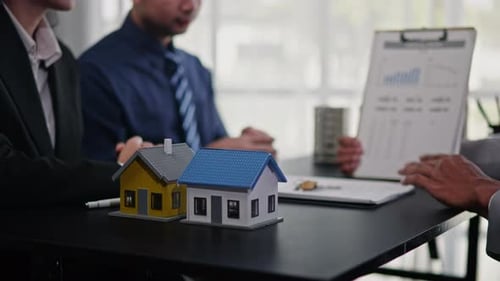 Businesspeople sell buy mortgage and signing agreement for apartment financial