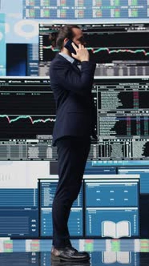 Vertical Video Male Entrepreneur Taking a Phone Call to Share Insight on KPI Metrics