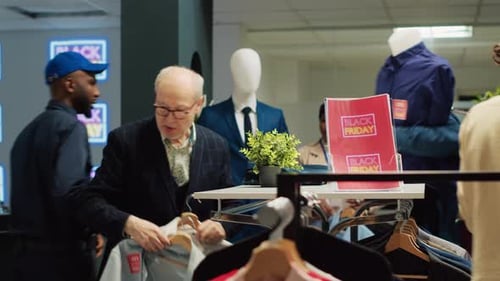 People Shopping for Clothes During Black Friday Sales