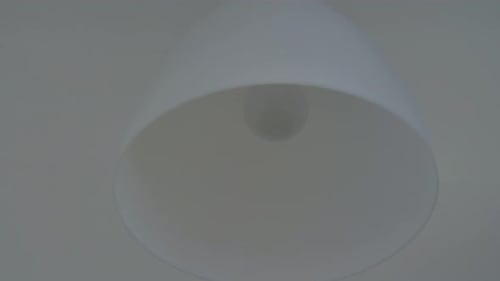 An Enlarged Image of a Chandelier with a Lamp That Turns on and Off Energy Electricity Innovation