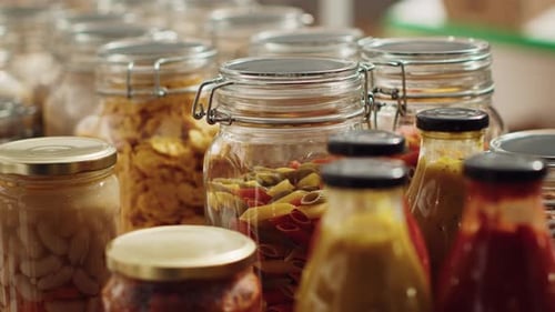 Organized Pantry Featuring Glass Jars and Food