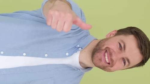 Man Giving Thumbs Up Gesture Smiling