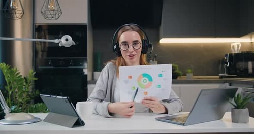 Young Woman Presenting Data During Video Conference