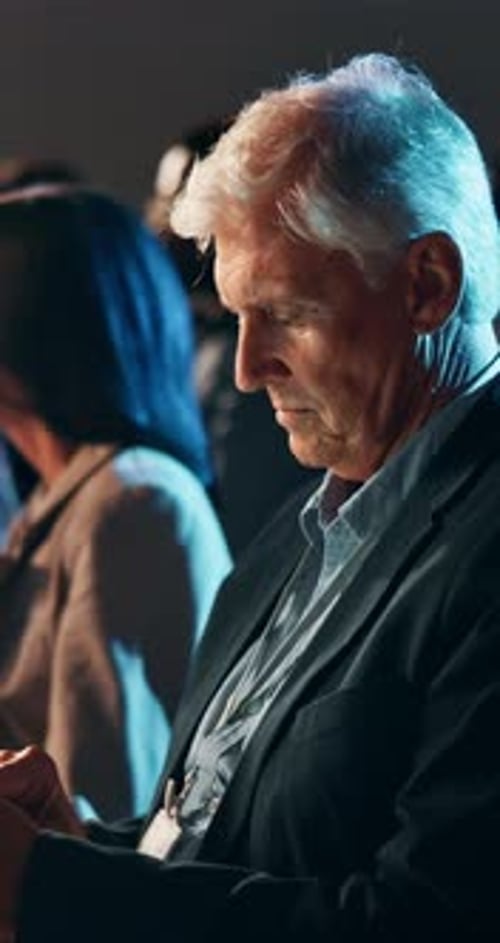 Man Listening Attentively at a Conference