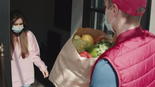 Grocery Delivery Man Wearing Mask Delivering to Woman