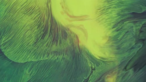 Abstract Green and Yellow Ink Flowing Together