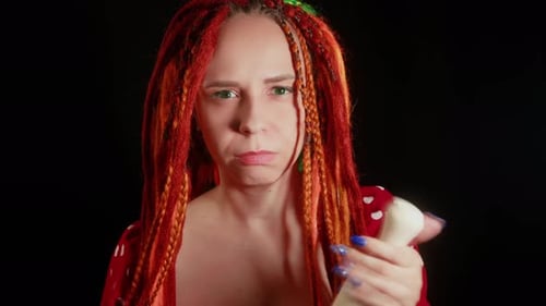 Stern Woman with Rolling Pin Stares at Camera