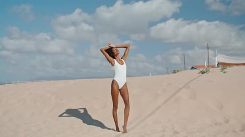 Beach Girl Enjoying Sunlight Posing in Bikini. Sexy African American Flirting Resting