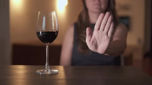 Woman Declines Glass of Wine