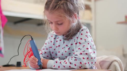 Girl Creates Art with 3D Printing Pen at Table