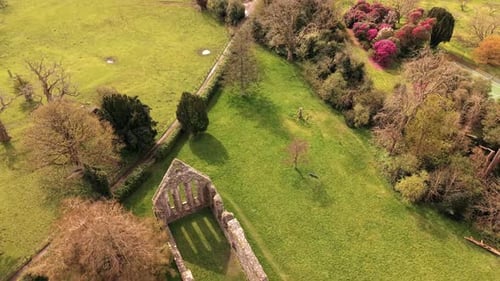 60FPS aerial reveal video GV of Greyabbey Monastery Ruins in Greyabbey, County Down